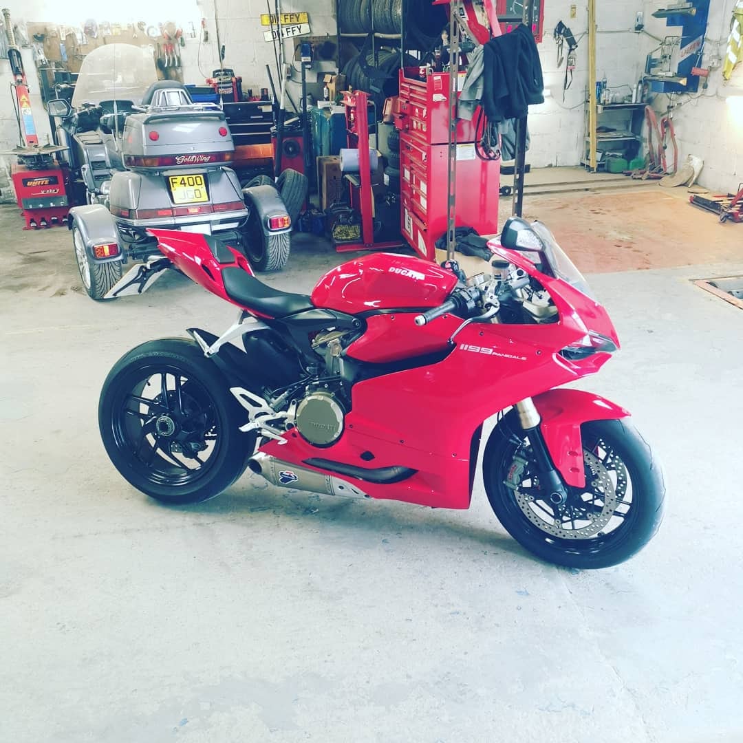 Red Ducati motorcycle inside the David Duffield workshop